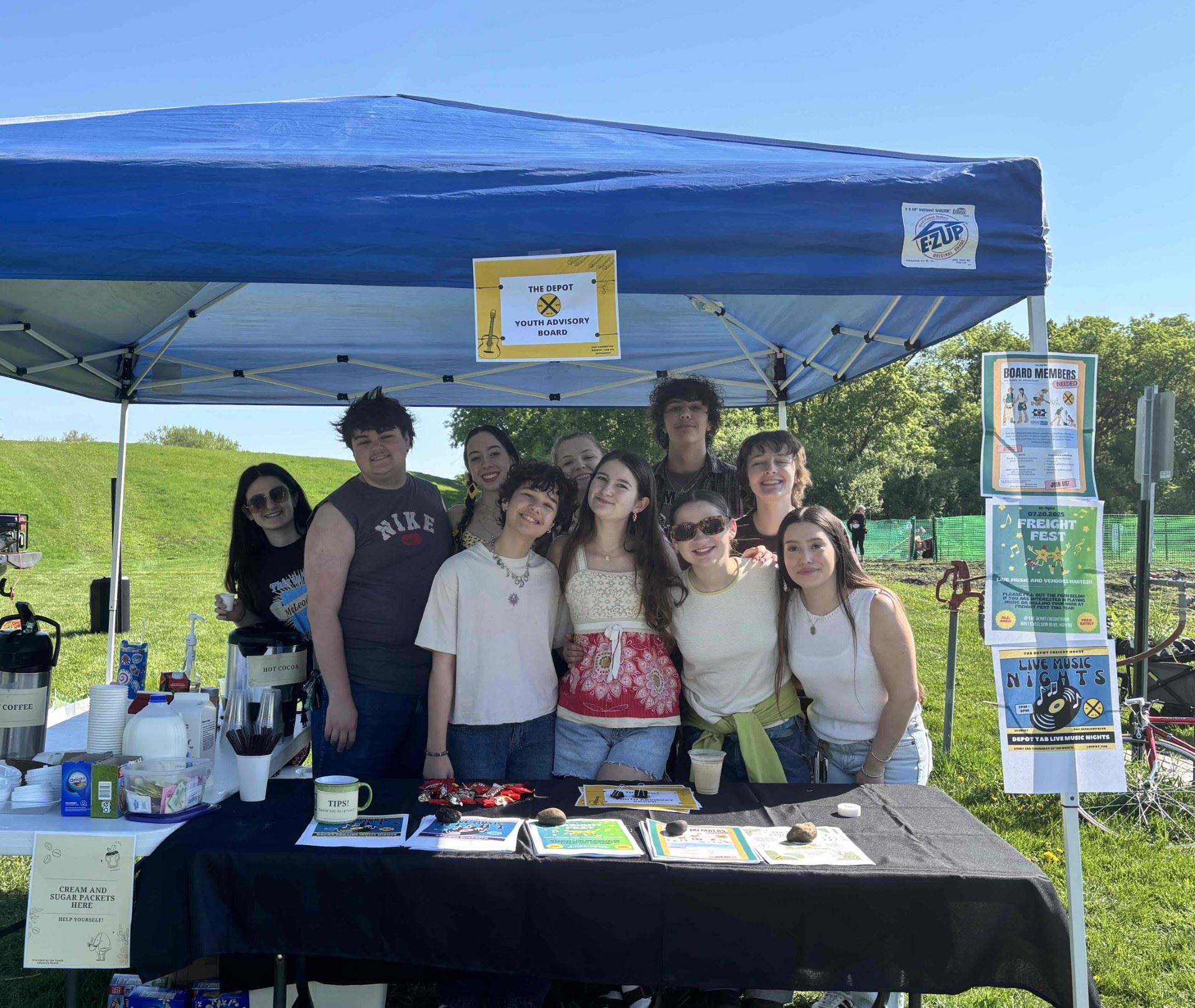 Youth from the Depot Youth Advisory Board stand at their booth during the Community Garden Kick-Off